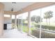 Screened porch overlooking a lush green golf course at 3959 San Rocco Ct # 911, Punta Gorda, FL 33950
