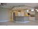 Open kitchen with granite island and stainless steel appliances at 3959 San Rocco Ct # 911, Punta Gorda, FL 33950