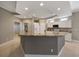 Spacious kitchen with a large island, granite countertops, and white cabinetry at 3959 San Rocco Ct # 911, Punta Gorda, FL 33950
