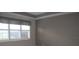 Bedroom with plantation shutters and window at 3959 San Rocco Ct # 911, Punta Gorda, FL 33950