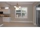 Elegant dining area with chandelier and plantation shutters at 3959 San Rocco Ct # 911, Punta Gorda, FL 33950