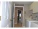 Laundry room with washer, dryer, cabinets, and access to other rooms at 3959 San Rocco Ct # 911, Punta Gorda, FL 33950