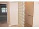 Bathroom featuring a large glass block shower and grab bar at 3959 San Rocco Ct # 911, Punta Gorda, FL 33950