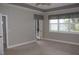 Bright Primary bedroom with carpet flooring, sliding glass doors, and neutral walls at 3959 San Rocco Ct # 911, Punta Gorda, FL 33950