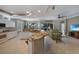 Open kitchen boasting granite countertops, white cabinets, and stainless steel appliances at 3959 San Rocco Ct # 911, Punta Gorda, FL 33950