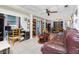 Open living area with tiled floors and multiple seating areas at 335 Kenova St, Port Charlotte, FL 33954