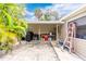 Covered patio with grill and plenty of space for entertaining at 335 Kenova St, Port Charlotte, FL 33954