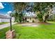 Charming single-story house with a well-maintained front yard at 335 Kenova St, Port Charlotte, FL 33954