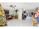 Living room features tile floors and a decorative autumnal theme at 335 Kenova St, Port Charlotte, FL 33954