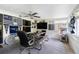 Relaxing screened porch with multiple fans at 335 Kenova St, Port Charlotte, FL 33954