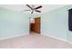Spacious bedroom with tile floors and ceiling fan at 335 Kenova St, Port Charlotte, FL 33954