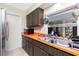 Kitchen features orange countertops, a double sink and ample cabinet space at 335 Kenova St, Port Charlotte, FL 33954