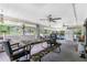 Screened porch with seating and a fridge at 335 Kenova St, Port Charlotte, FL 33954