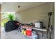 Convenient outdoor kitchen area with prep table and appliances at 335 Kenova St, Port Charlotte, FL 33954