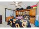 Main bedroom with sunflower bedding and ample dresser space at 335 Kenova St, Port Charlotte, FL 33954