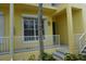 Inviting exterior of condo building with landscaped entryway at 2000 Bal Harbor Blvd # 1012, Punta Gorda, FL 33950