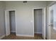 Bedroom with double closets and wood-look tile floors at 2000 Bal Harbor Blvd # 1012, Punta Gorda, FL 33950