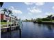 Peaceful canal view with boats and lush greenery at 2000 Bal Harbor Blvd # 1012, Punta Gorda, FL 33950