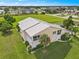 Condo building, lush landscaping, and lake view at 26283 Nadir Rd # 201, Punta Gorda, FL 33983