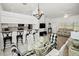 Bright dining area with glass-top table and black and white checkered chairs at 26283 Nadir Rd # 201, Punta Gorda, FL 33983