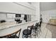 Kitchen features granite countertops and a breakfast bar with seating at 26283 Nadir Rd # 201, Punta Gorda, FL 33983