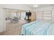 Bedroom with king-size bed and access to screened porch at 26283 Nadir Rd # 201, Punta Gorda, FL 33983