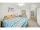 Bright bedroom with king-size bed and access to bathroom at 26283 Nadir Rd # 201, Punta Gorda, FL 33983