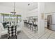 Open concept kitchen and dining area with granite counters and stainless steel appliances at 26283 Nadir Rd # 201, Punta Gorda, FL 33983