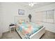 Bedroom with queen-size bed and coastal decor at 26283 Nadir Rd # 201, Punta Gorda, FL 33983