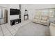 Living Room with reclining sofa and built-in entertainment center at 26283 Nadir Rd # 201, Punta Gorda, FL 33983