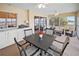 Sunroom with lake view, built-in cabinets, and seating area at 26283 Nadir Rd # 201, Punta Gorda, FL 33983