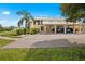 Building exterior with carport and landscaping at 26283 Nadir Rd # 201, Punta Gorda, FL 33983