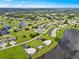 Aerial view of community near golf course and lake at 26283 Nadir Rd # 201, Punta Gorda, FL 33983