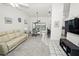 Open living room with vaulted ceilings and neutral decor at 26283 Nadir Rd # 201, Punta Gorda, FL 33983