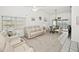 Bright living room with vaulted ceiling, neutral walls, and comfy reclining sofas at 26283 Nadir Rd # 201, Punta Gorda, FL 33983