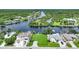 Aerial view of waterfront property with canal access and surrounding homes at 13216 Donaldson Ave, Port Charlotte, FL 33953