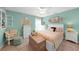 Spacious bedroom with queen bed and sitting area at 13216 Donaldson Ave, Port Charlotte, FL 33953