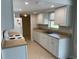 Modern kitchen with white cabinets and light countertops at 240 Cicero Nw St, Port Charlotte, FL 33948