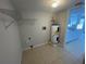 Laundry area with shelving and water heater at 240 Cicero Nw St, Port Charlotte, FL 33948