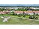Aerial view of condo building with pool and golf course at 3959 San Rocco Ct # 911, Punta Gorda, FL 33950