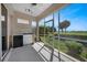 Screened lanai with outdoor kitchen, mini-fridge & golf course view at 3959 San Rocco Ct # 911, Punta Gorda, FL 33950