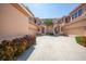 Three-story building with attached garages and lush landscaping at 3959 San Rocco Ct # 911, Punta Gorda, FL 33950