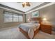 Relaxing bedroom with a wooden bed frame and neutral decor at 3959 San Rocco Ct # 911, Punta Gorda, FL 33950