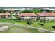 Aerial view of condo building, pool, and golf course at 3959 San Rocco Ct # 911, Punta Gorda, FL 33950