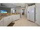 Modern kitchen with white cabinets, granite countertops, and a large refrigerator at 3959 San Rocco Ct # 911, Punta Gorda, FL 33950
