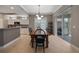 Elegant dining room featuring a farmhouse table and access to the outdoors at 3959 San Rocco Ct # 911, Punta Gorda, FL 33950