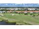 Aerial view of multiple condo buildings near a golf course at 3959 San Rocco Ct # 911, Punta Gorda, FL 33950