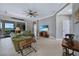Living room with golf course views, featuring comfortable seating and a large TV at 3959 San Rocco Ct # 911, Punta Gorda, FL 33950