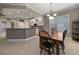Charming dining room with a wooden table, black chairs, and a chandelier at 3959 San Rocco Ct # 911, Punta Gorda, FL 33950