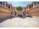 Three-story building with attached garages and lush landscaping at 3959 San Rocco Ct # 911, Punta Gorda, FL 33950